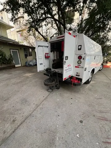 Magnet Plumbing service vehicle on-site for Grease Trap Cleaning in Chicasaw Gardens